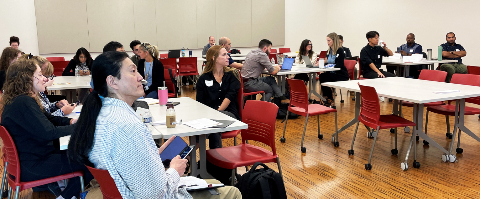 New Faculty Orientation attendees focus their attention on a speaker in Sangren Hall