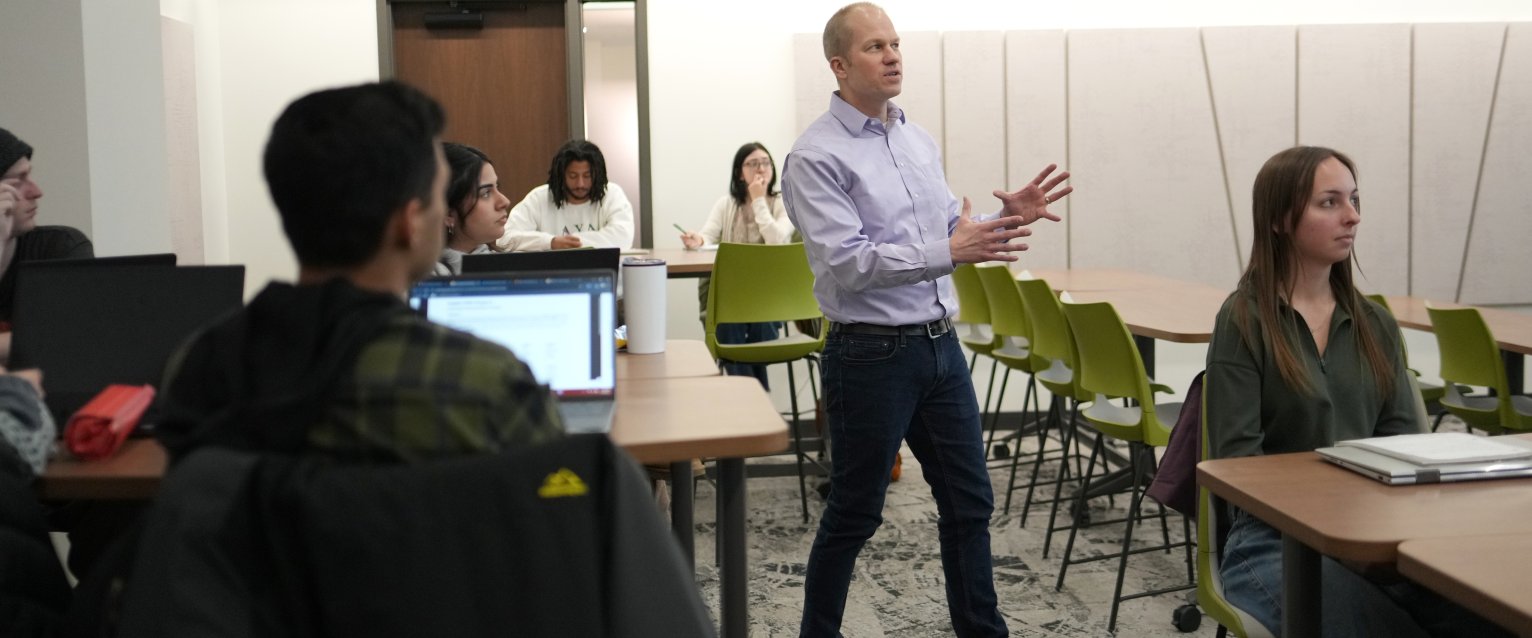 Dr. Gogan in Dunbar Hall classroom, teaching
