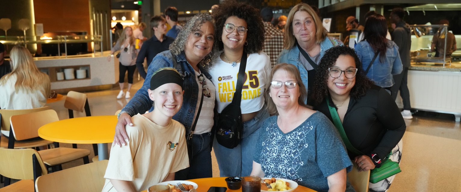 The family of a WMU student pose for a group photo in the Valley Dining Center.