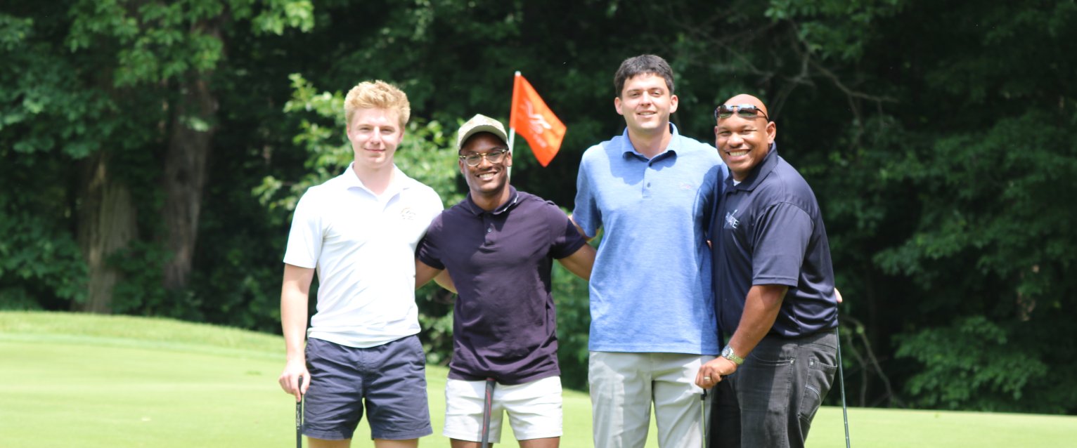 Group of people on golf hole