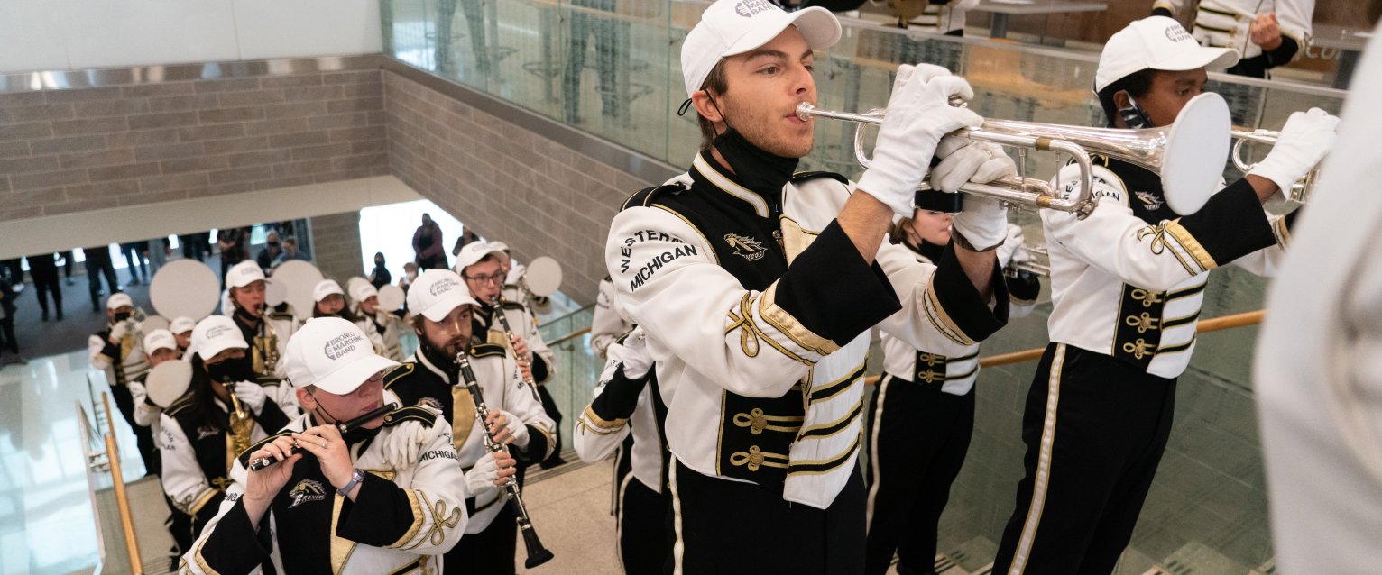 WMU's Marching Band doing a pop-up performance on the stairs of Sangren Hall.