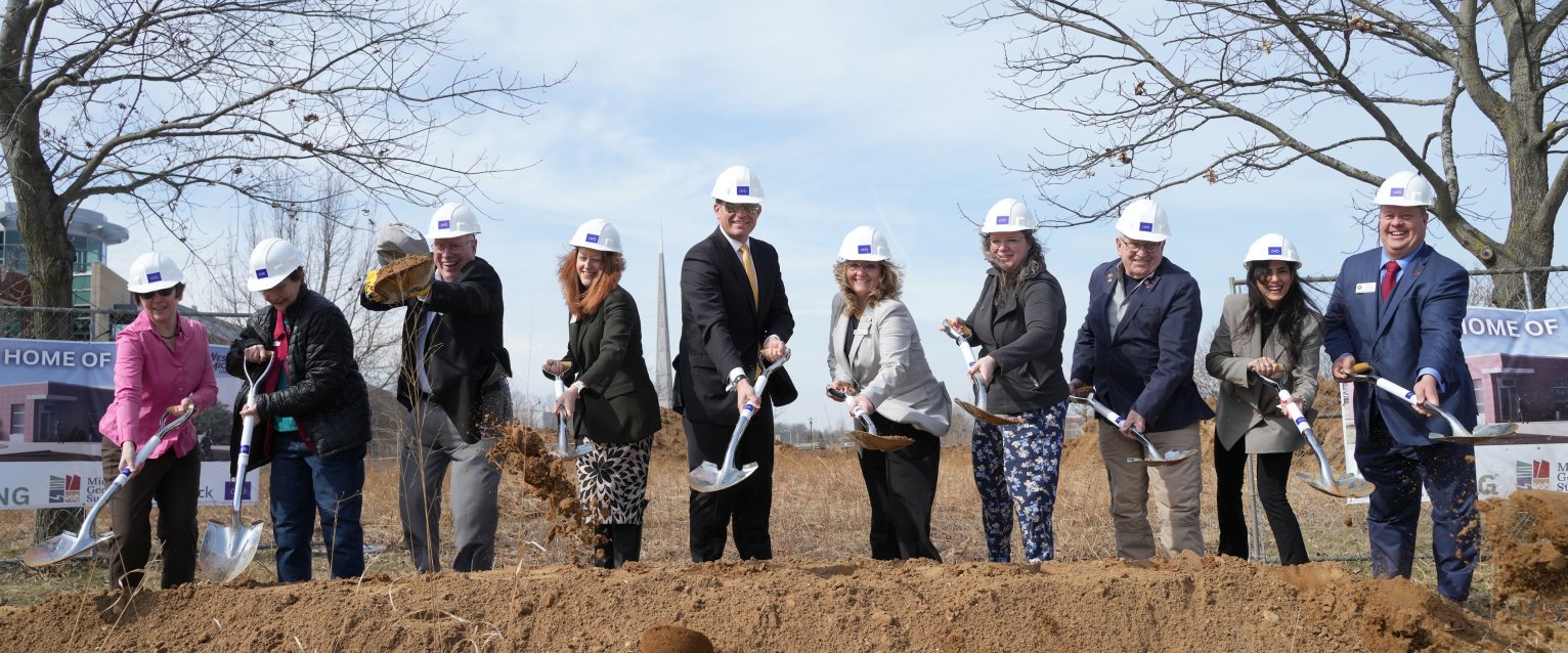President Russ Kavalhuna and other stakeholders from WMU and the Michigan Geological Survey use their shovels to break ground on the new Michigan Geological Repository for Research and Education.