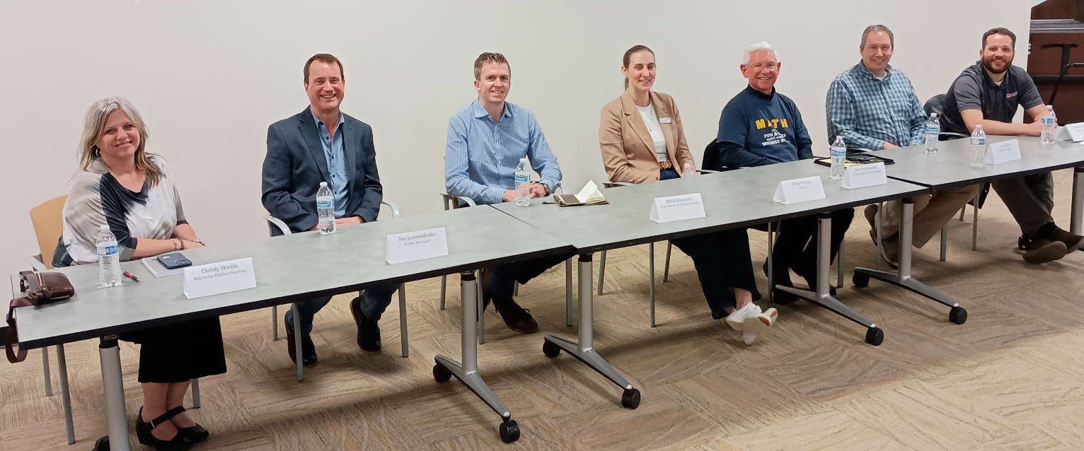 2026 Pi Day Panel at a table in Floyd Hall