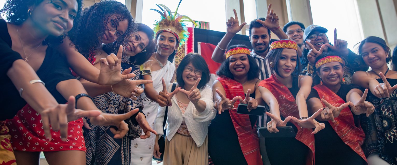 Student pose in costumes from around the world at International Festival.