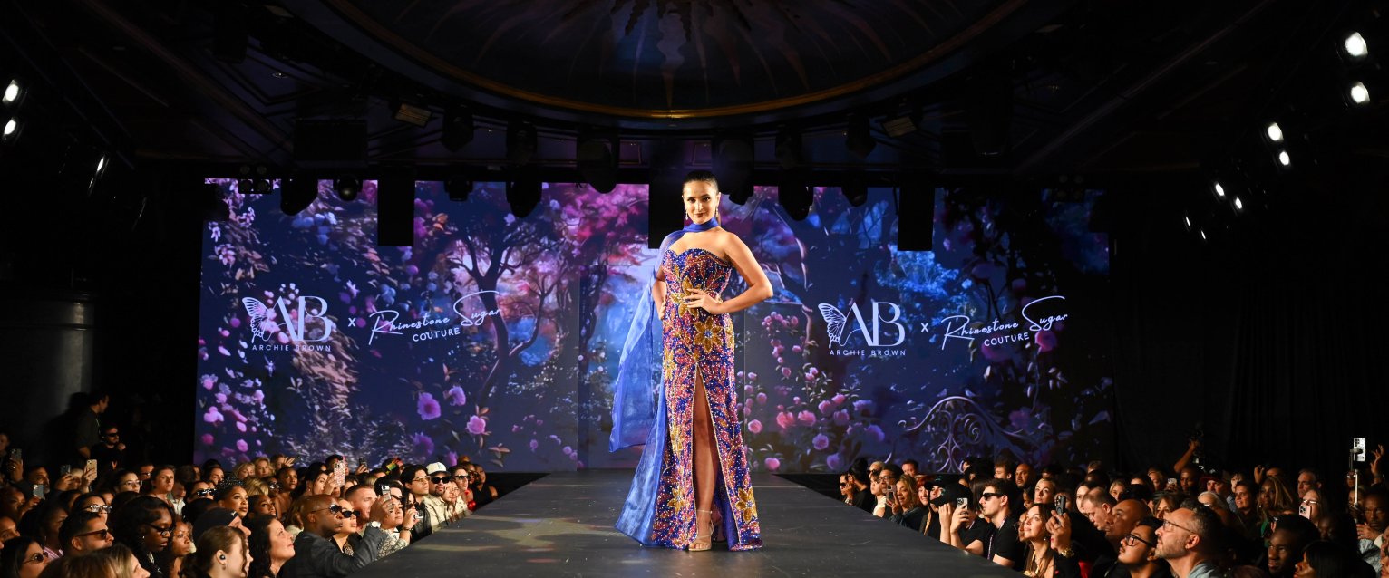 Maya Narayan models a gown on the runway at New York Fashion Week.