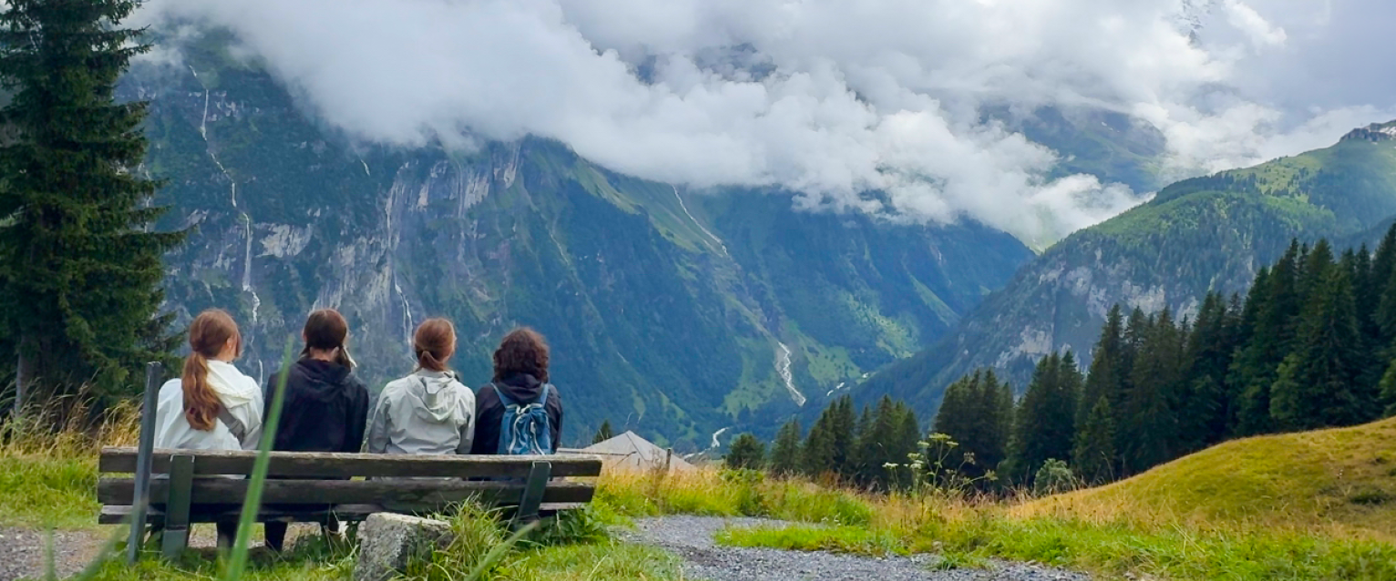 A group of students staring at the beautiful mountainside