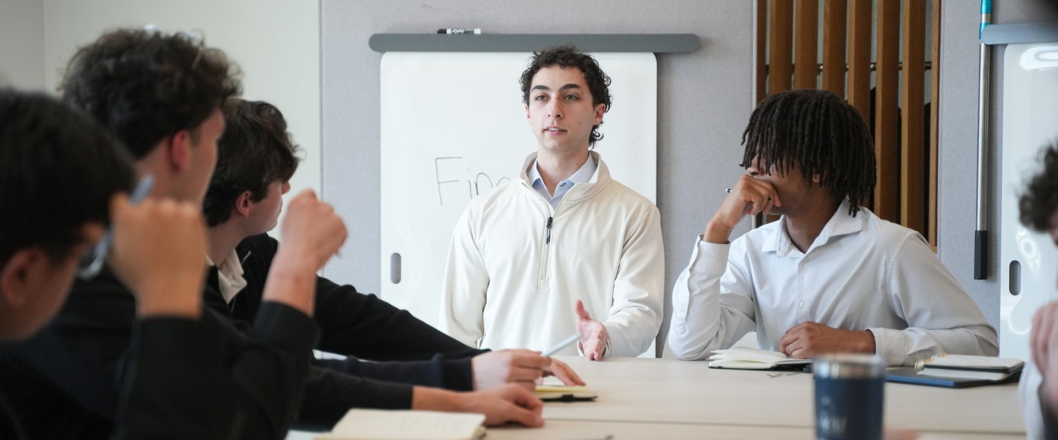 A student presenting in front of fellow broncos