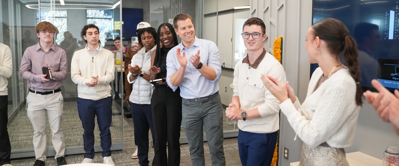 A group of students applauding their successes