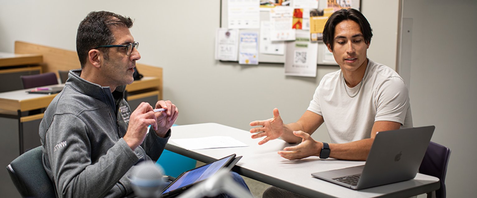 A professor advising his Student