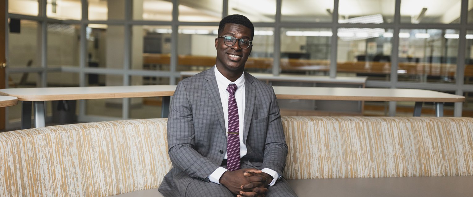 Mo Tall in a Schneider Hall conference room