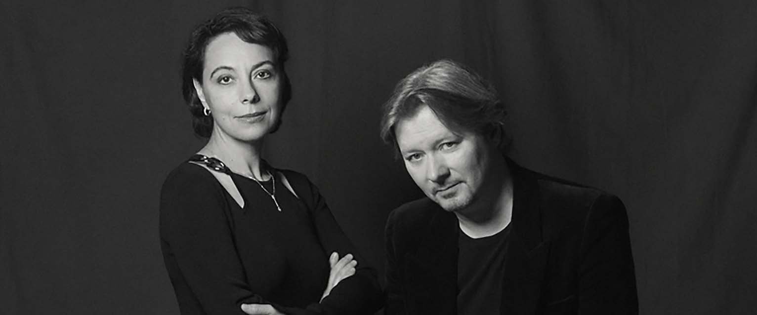 black and white photo of woman and man wearing all black clothing