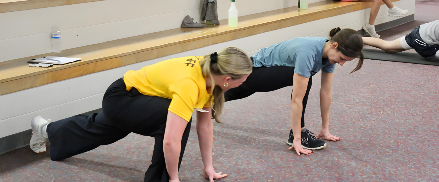 WMU SRC Personal Trainer guiding a client through a workout