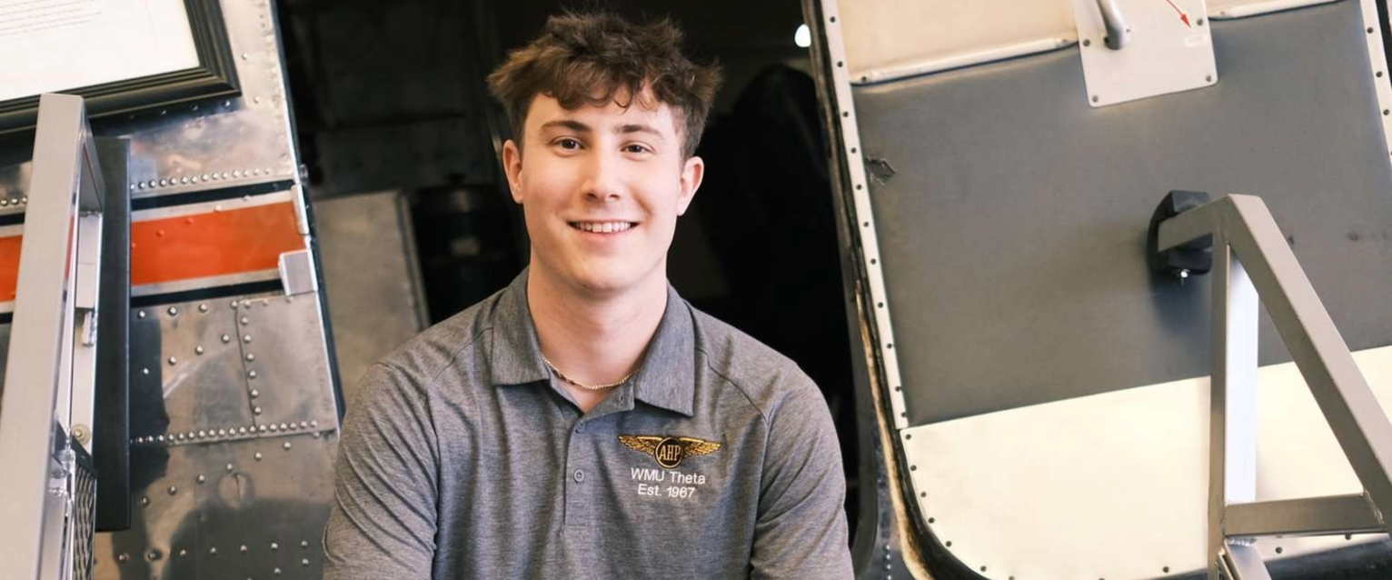 Student sitting in plane.