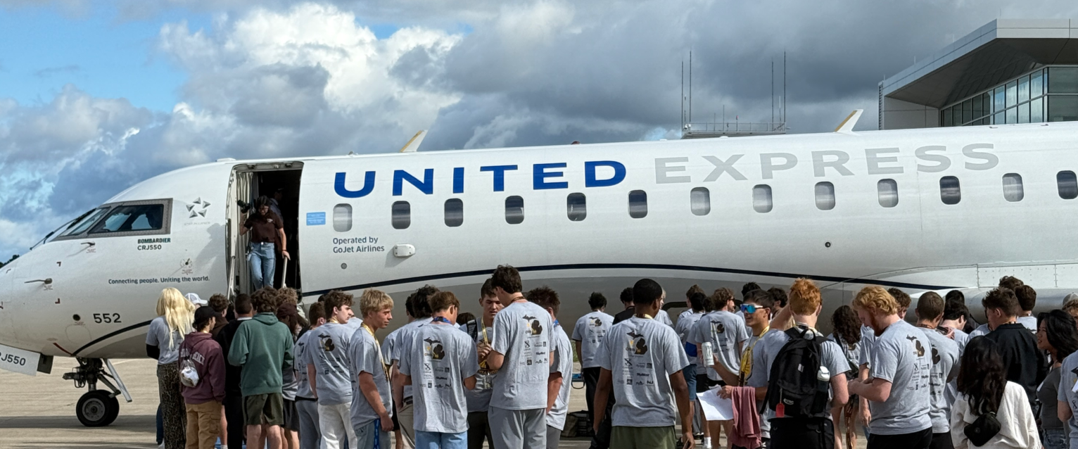 Students in front of jet