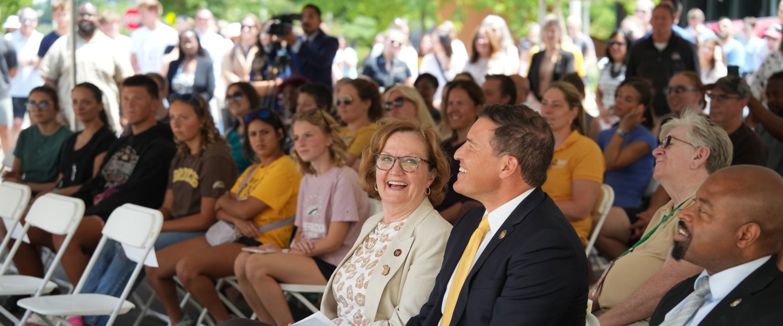 VP Diane Anderson, President Kavalhuna and Trustees James Liggins sit with the crowd at the Valley Oaks ribbon cutting.