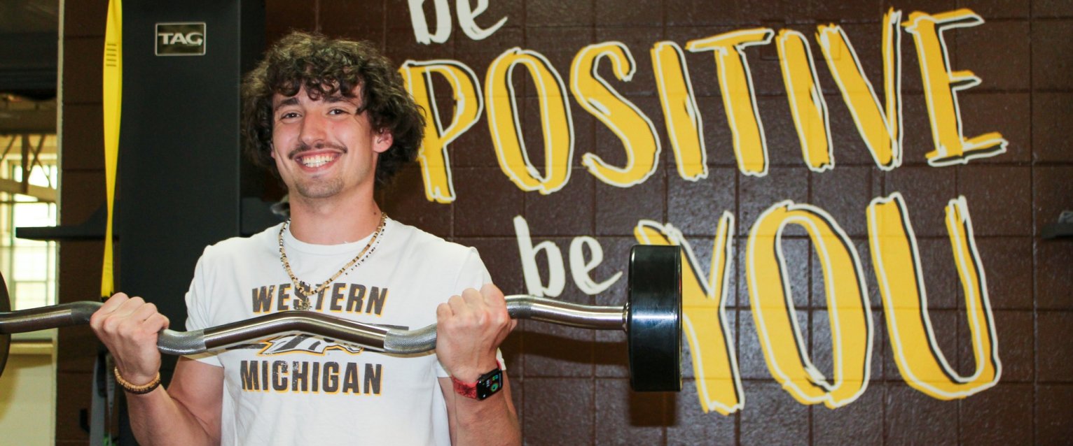 WMU student lifting weights