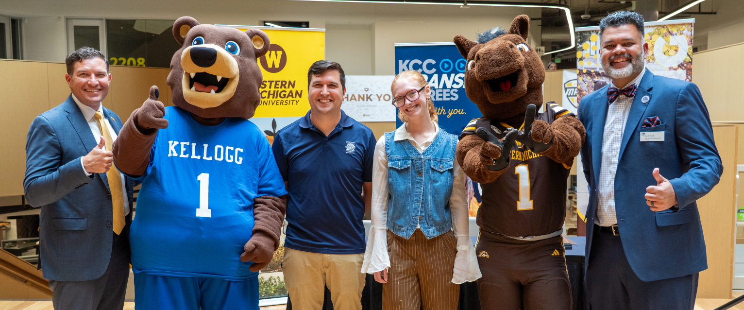 A group photo with WMU President Russ Kavalhuna, KCC mascot Blaze, students Chad Singleterry and Carleigh Hassing, mascot Buster Bronco and KCC President Paul Watson II.