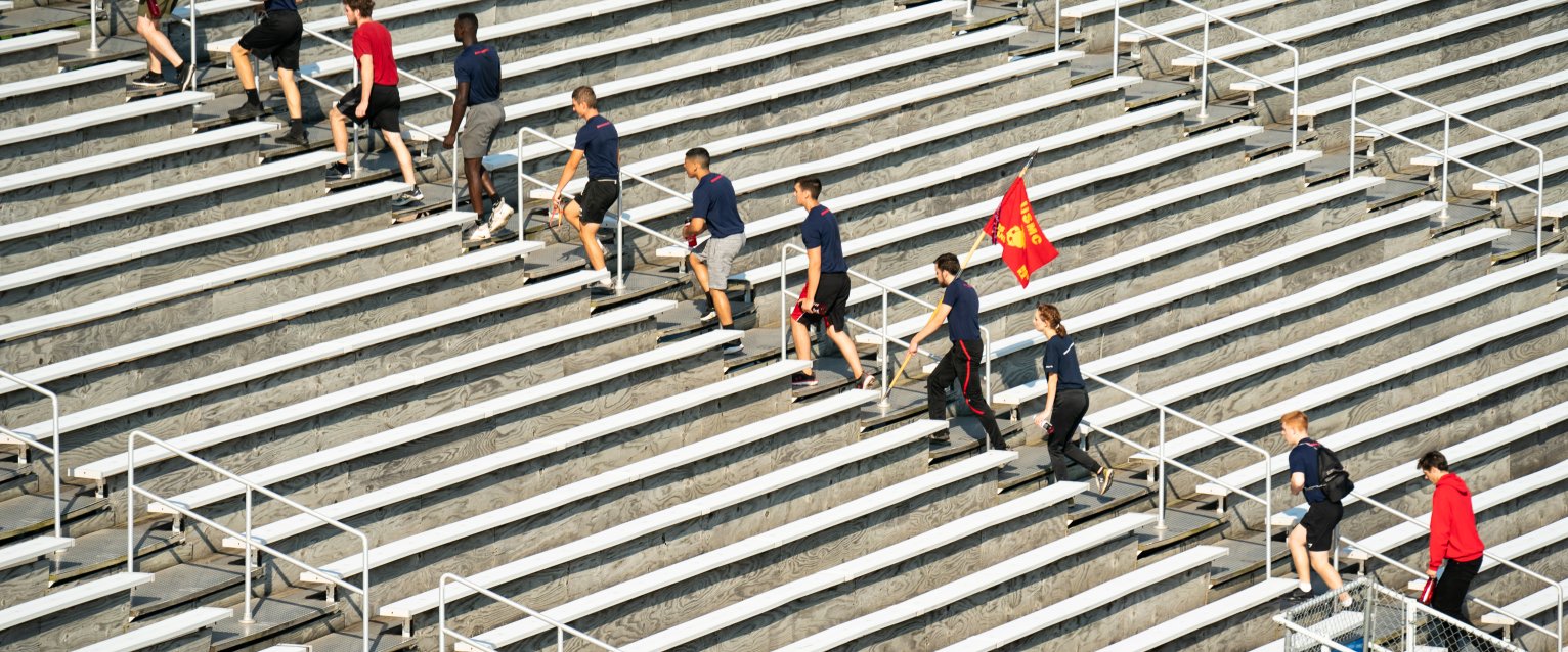 Silent climb participants walking up a row in Waldo Stadium.