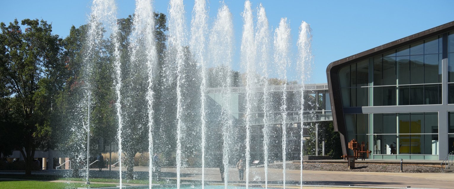 A photo of the fountains and Art Center on a summer day