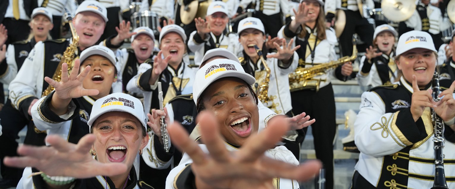 The Bronco Marching Band having fun in the Waldo stands.