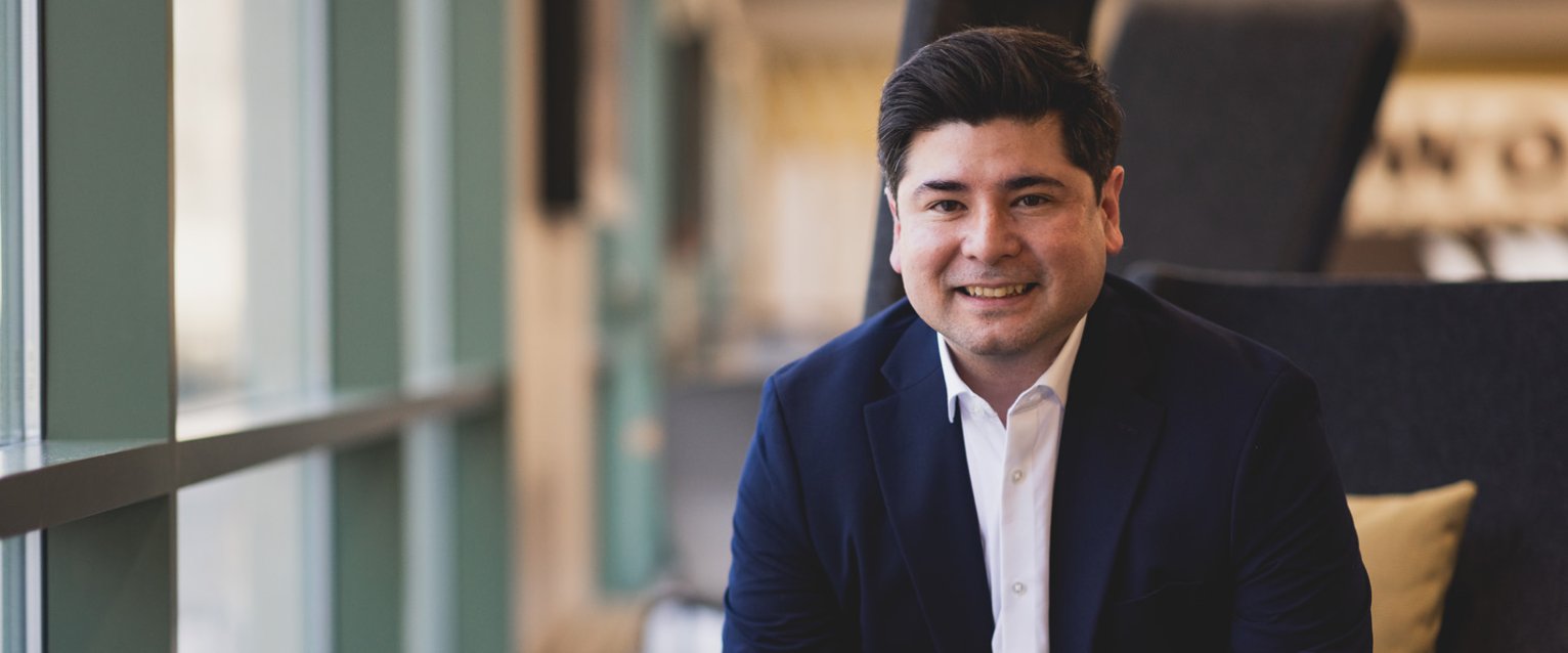 MBA student Guillermo Hiyane seated