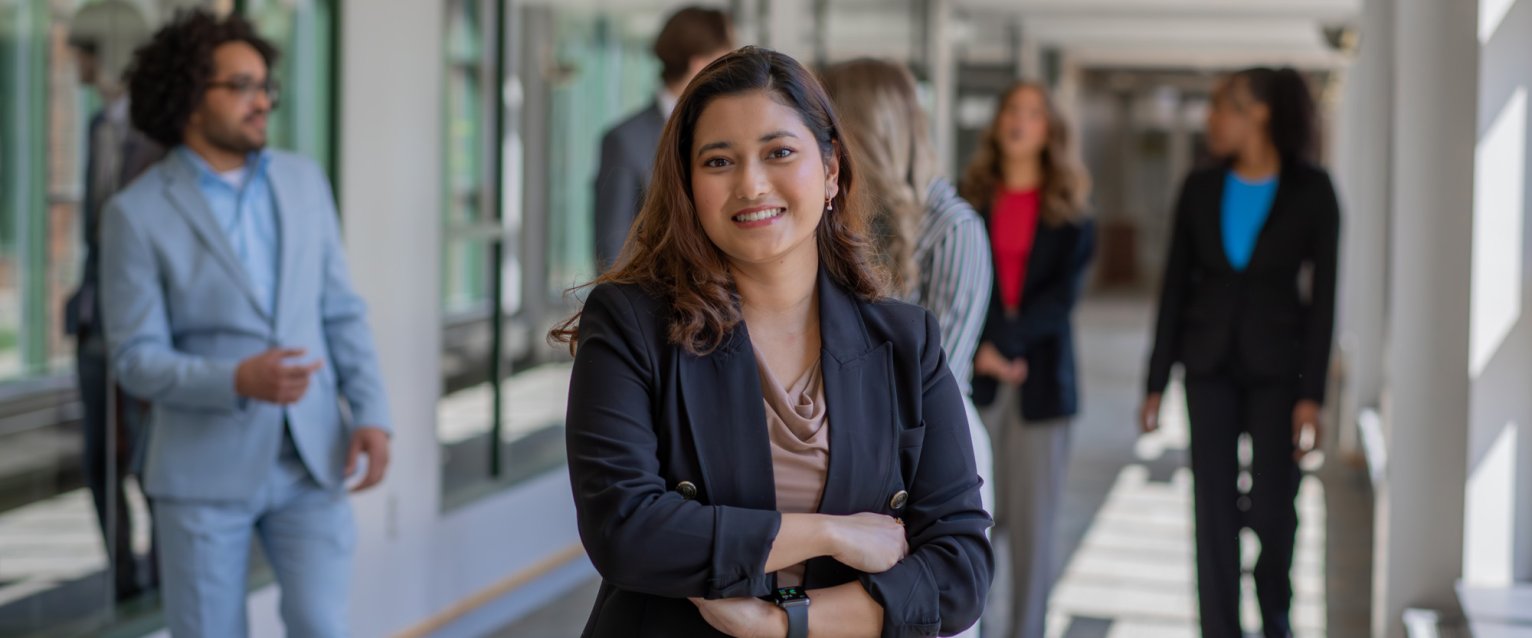 Female student wearing blazer in the hallway 