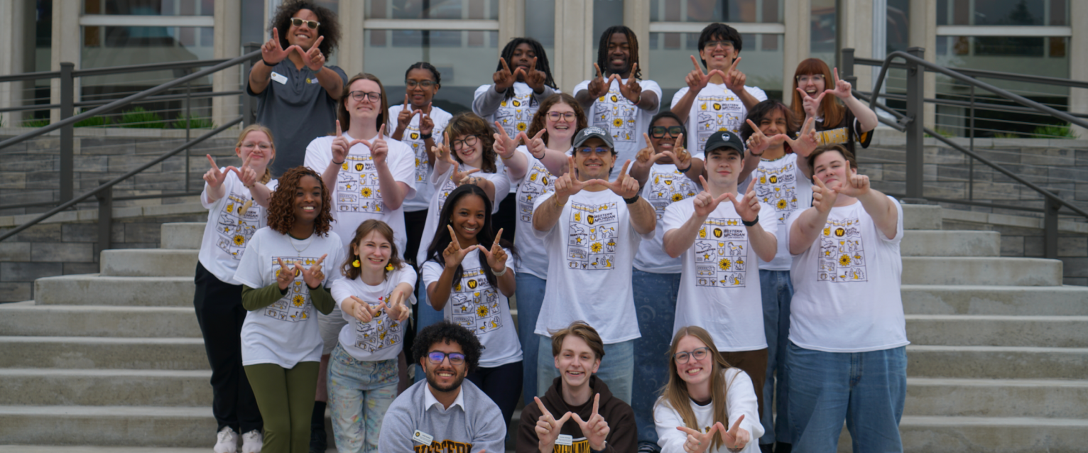 Orientation Leaders posing doing the "w" pose for media day