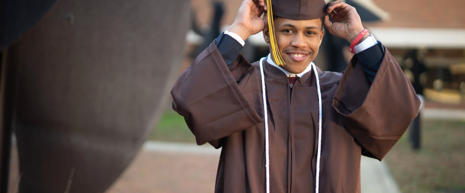 A photo of JaJuan Kemp in his cap and gown.