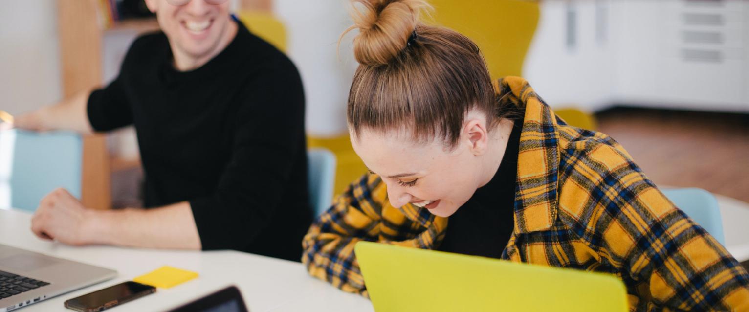 Two students laughing