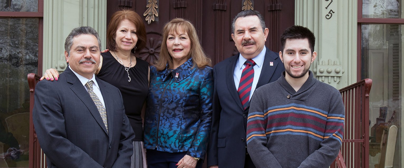 Flores family standing outside Oaklands