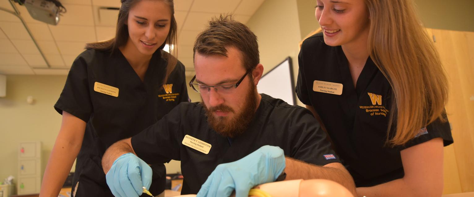 Nursing students practcing with IV