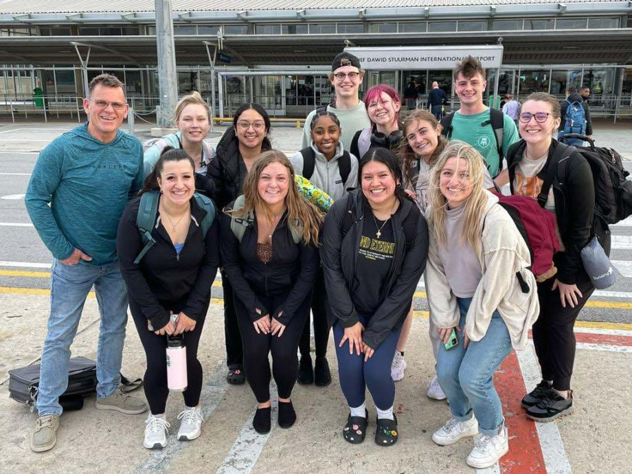Group of BSPH students at an airport
