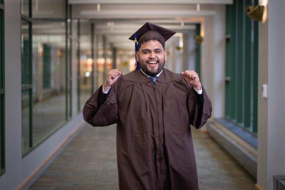 A portrait of Jesus Osvaldo Marinez-Jimenez in his graduation regalia.
