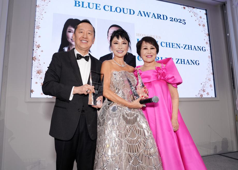 Charles Zhang and Lynn Chen-Zhang hold their awards.