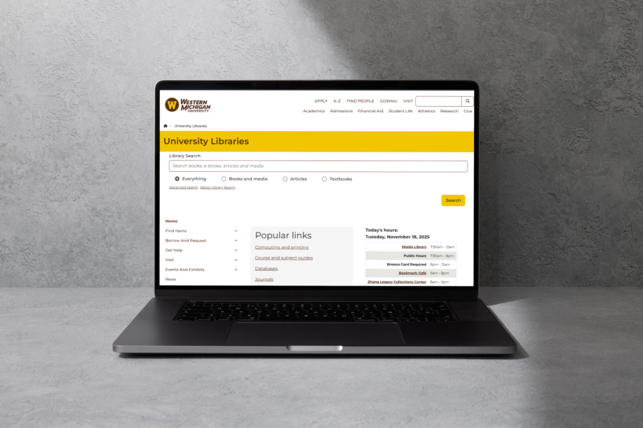 A laptop with a browser displaying the University Libraries website.