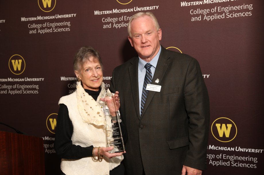 Margean Gladysz (left) is pictured with Dr. Steve Butt, dean, as she receives the Spire Award.
