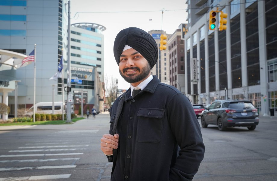 Arshpreet Singh crosses the street in downtown Kalamazoo.