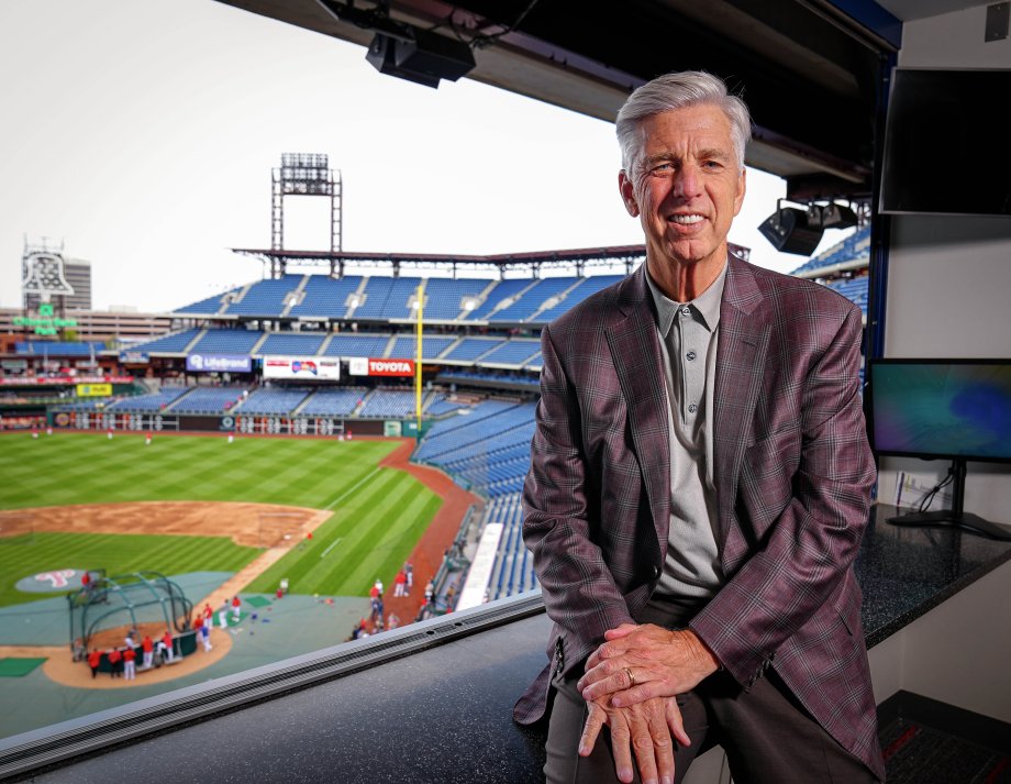 David Dombrowski sits in a box overlooking a baseball stadium.