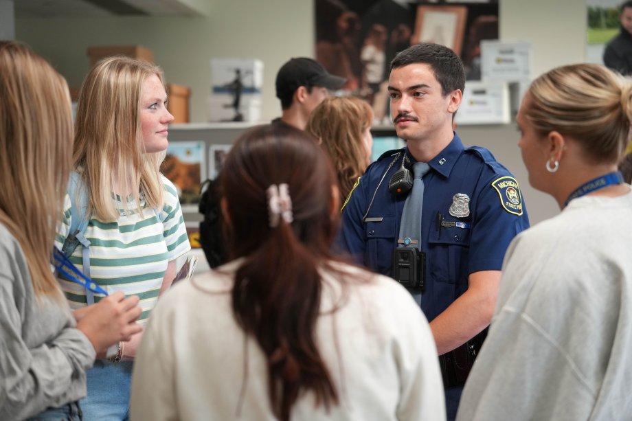 MSP Trooper Sean Montroy talks with students.