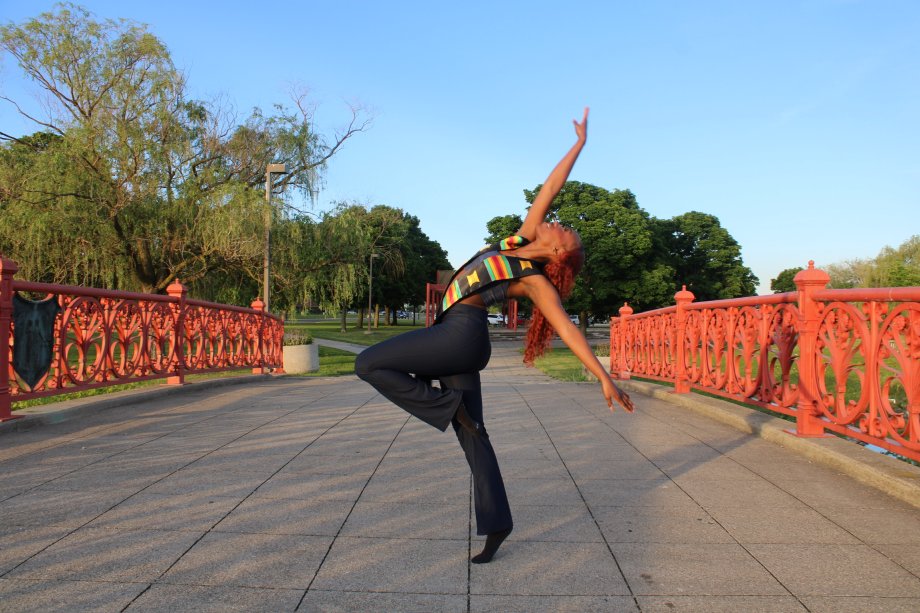 Shaniya Tate dances in the middle of a bridge.