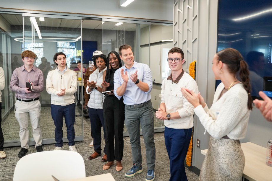 Doug Lepisto claps for students at Sleeping Giant Capital.