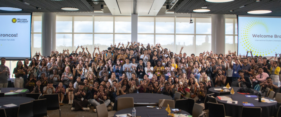 A group of international students poses at International Student Orientation.