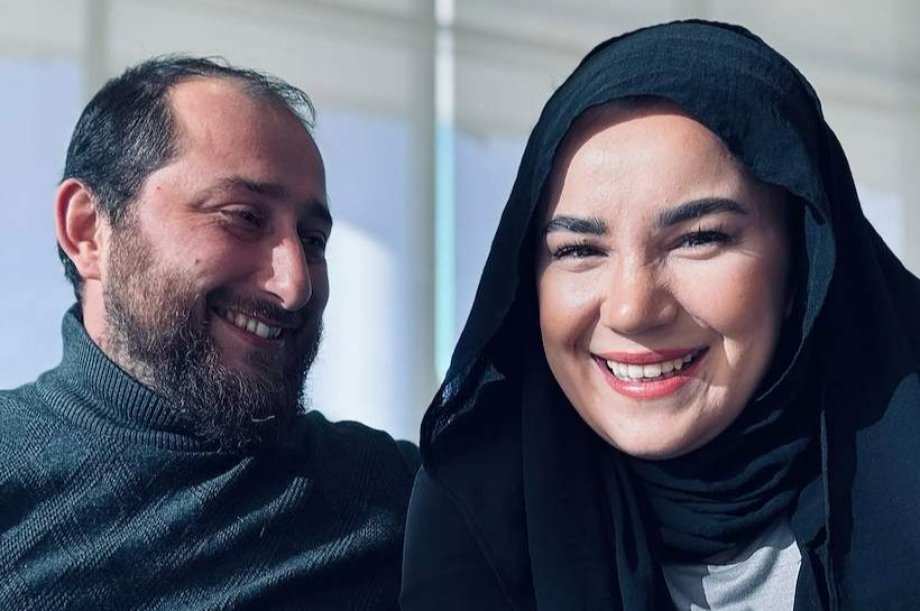 Halil and Fatma Dursunoğlu, spouses who met on WMU’s campus as students, smile together inside Ayasofya, the Turkish restaurant they co-own in Kalamazoo.