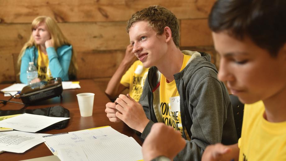 Camp participants seating at a table