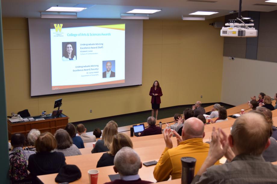 Dean Carla Koretsky stands at the front of an auditorium and gives 2019 State of the College Address for the College of Arts and Sciences