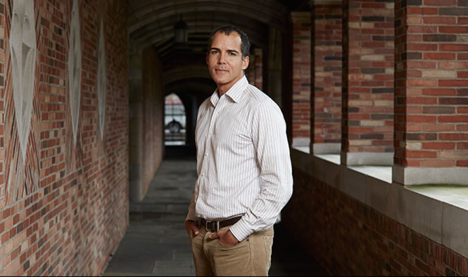 James Forman, Jr. standing in a hallway