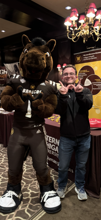 Owen and Buster making the W sign with their hands