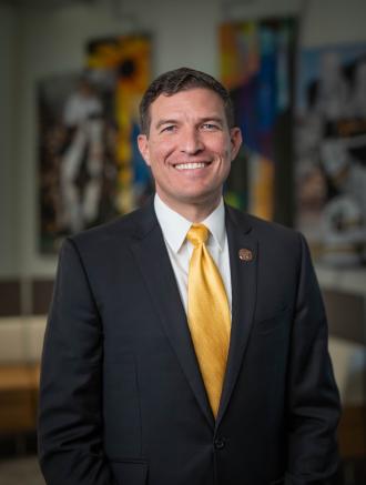 President Russ Kavalhuna