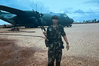 WMU Aviation Alumni and Retired Air Force Officer Tracy Smiedendorf in Honduras with C-130