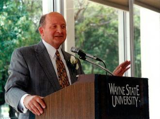Dr. Diether H. Haenicke, president emeritus and distinguished professor emeritus of Western Michigan University, speaking at an event.